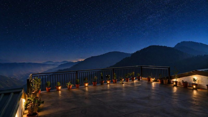 Hardys Retreat rooftop at night — starlit Himalayan sky with valley lights below