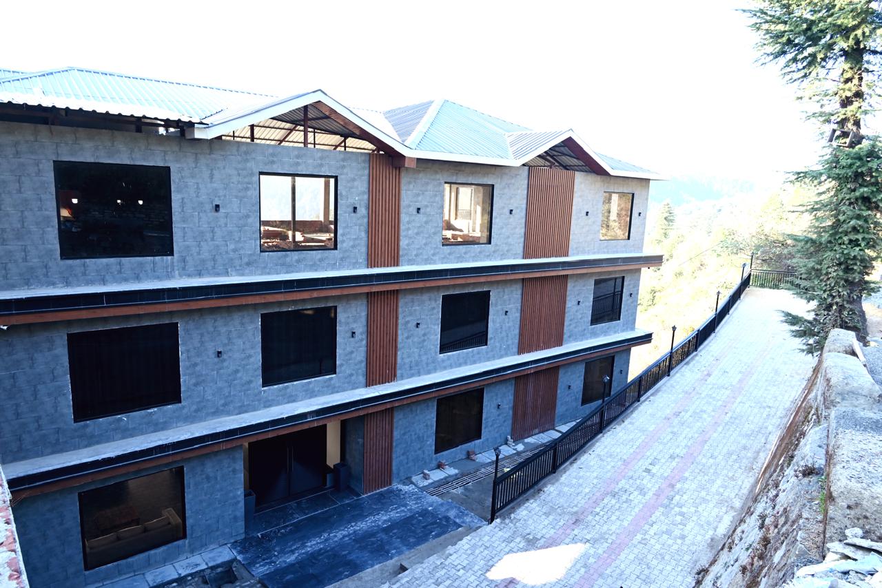 Hardys Retreat Chail stone exterior and paved approach with valley beyond